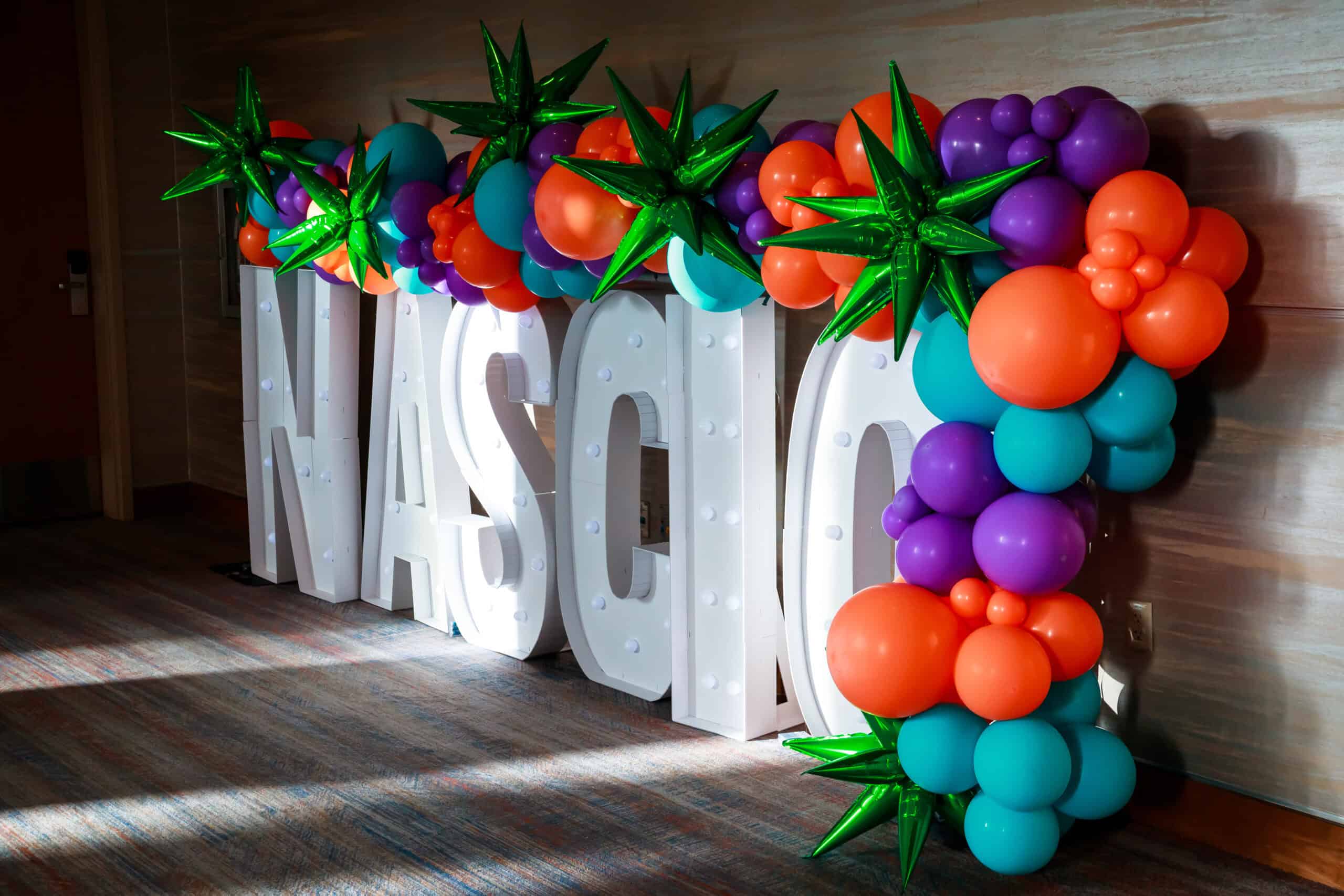 Lighted NASCIO logo with balloon decorations