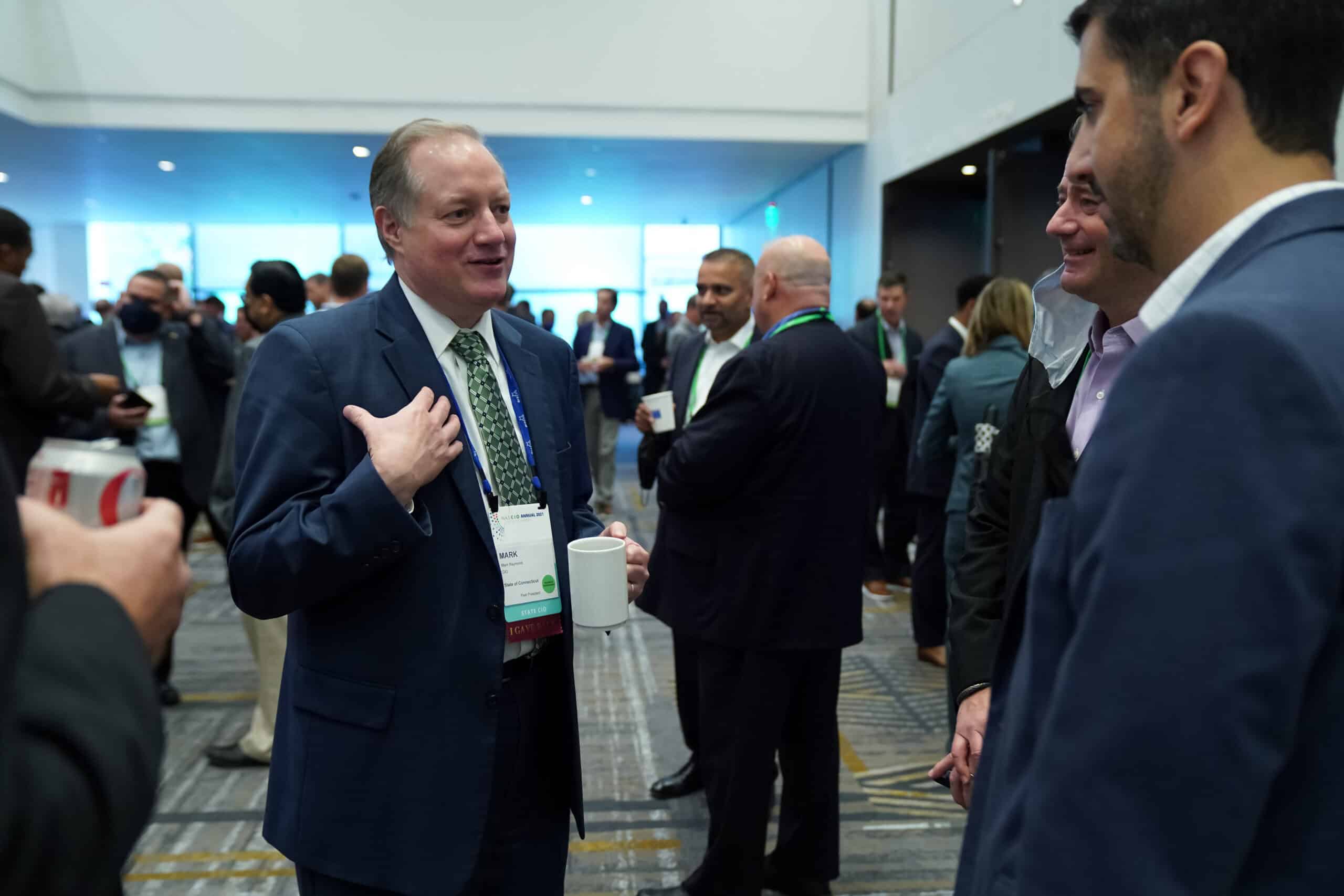 CIO speaking to a group of conference attendees