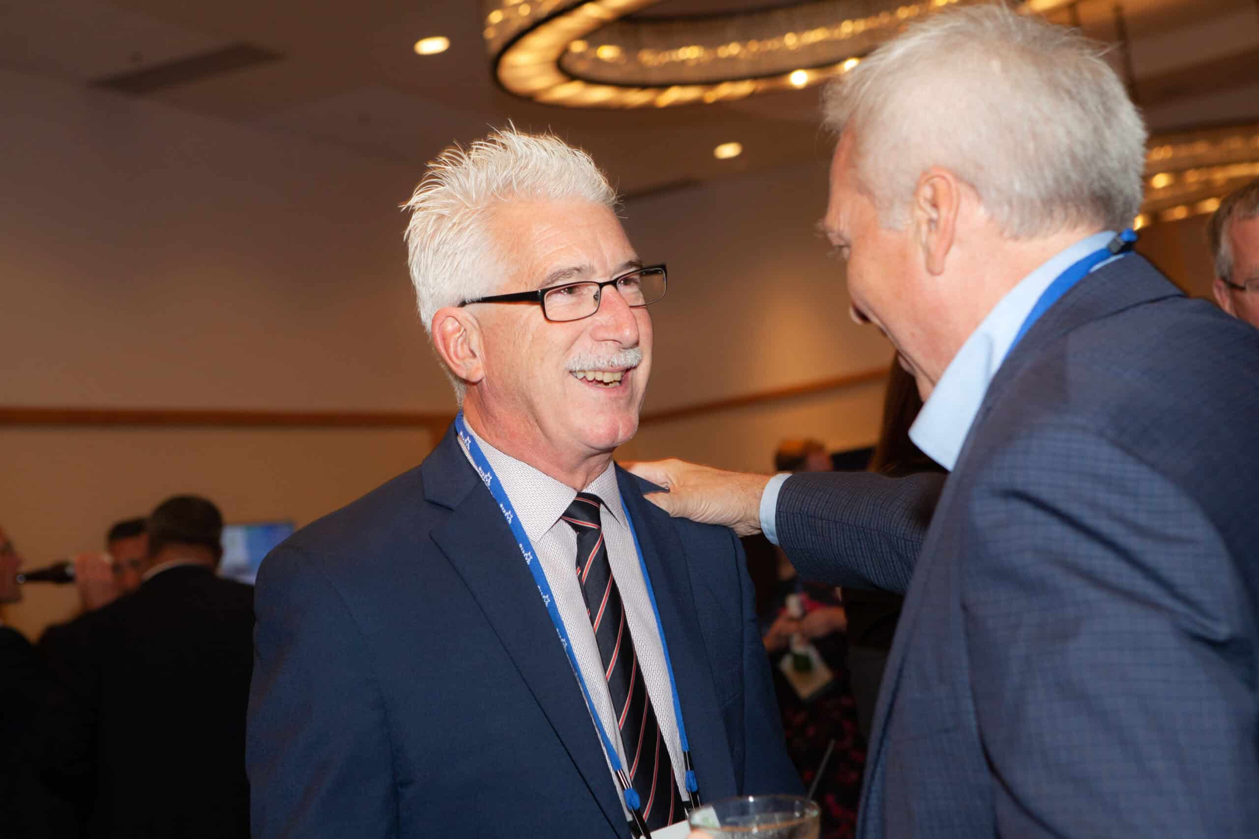 Two past president's shaking hands
