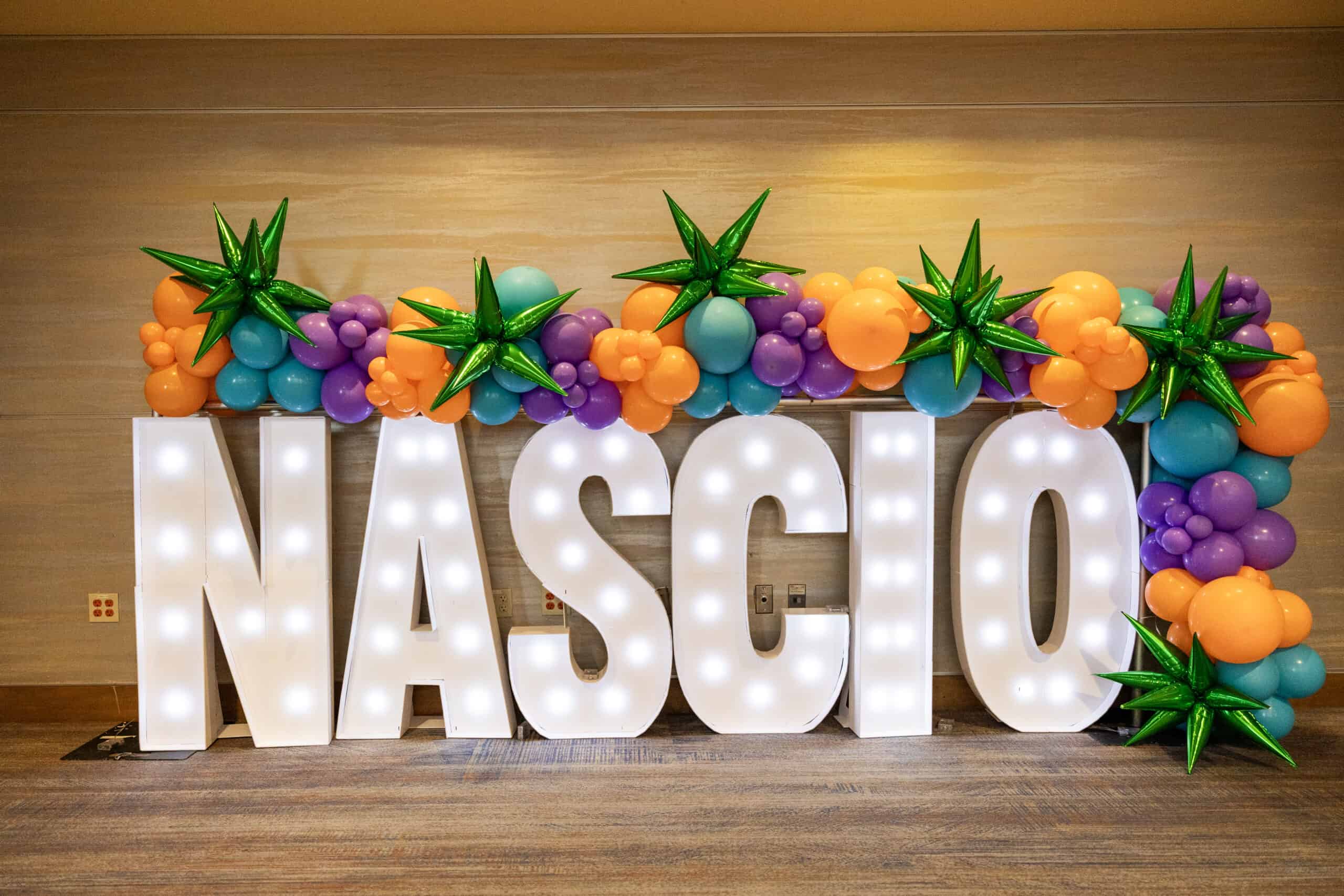 Lighted NASCIO logo with balloon decorations