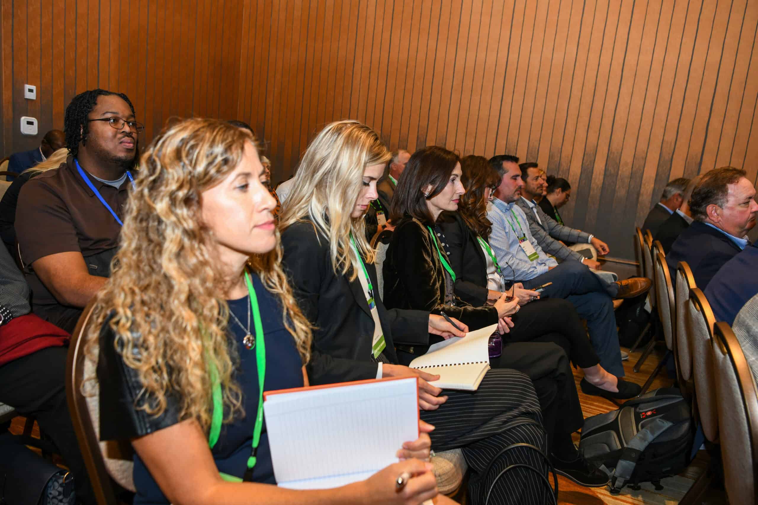 Attendees reading resources during a session